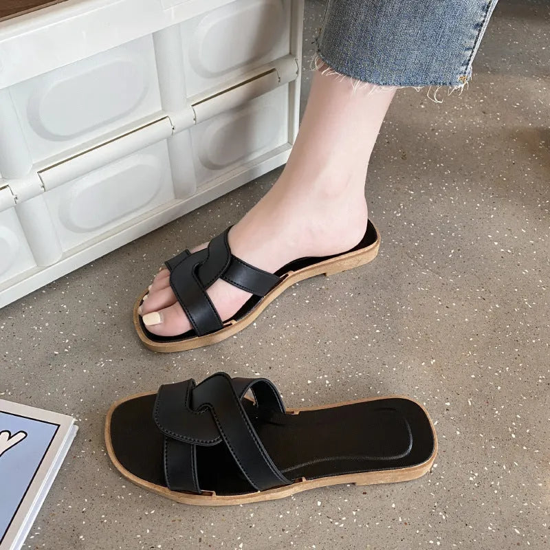 Women's PVC cross-strap sandals with toe ring and non-slip sole in light blue colour.