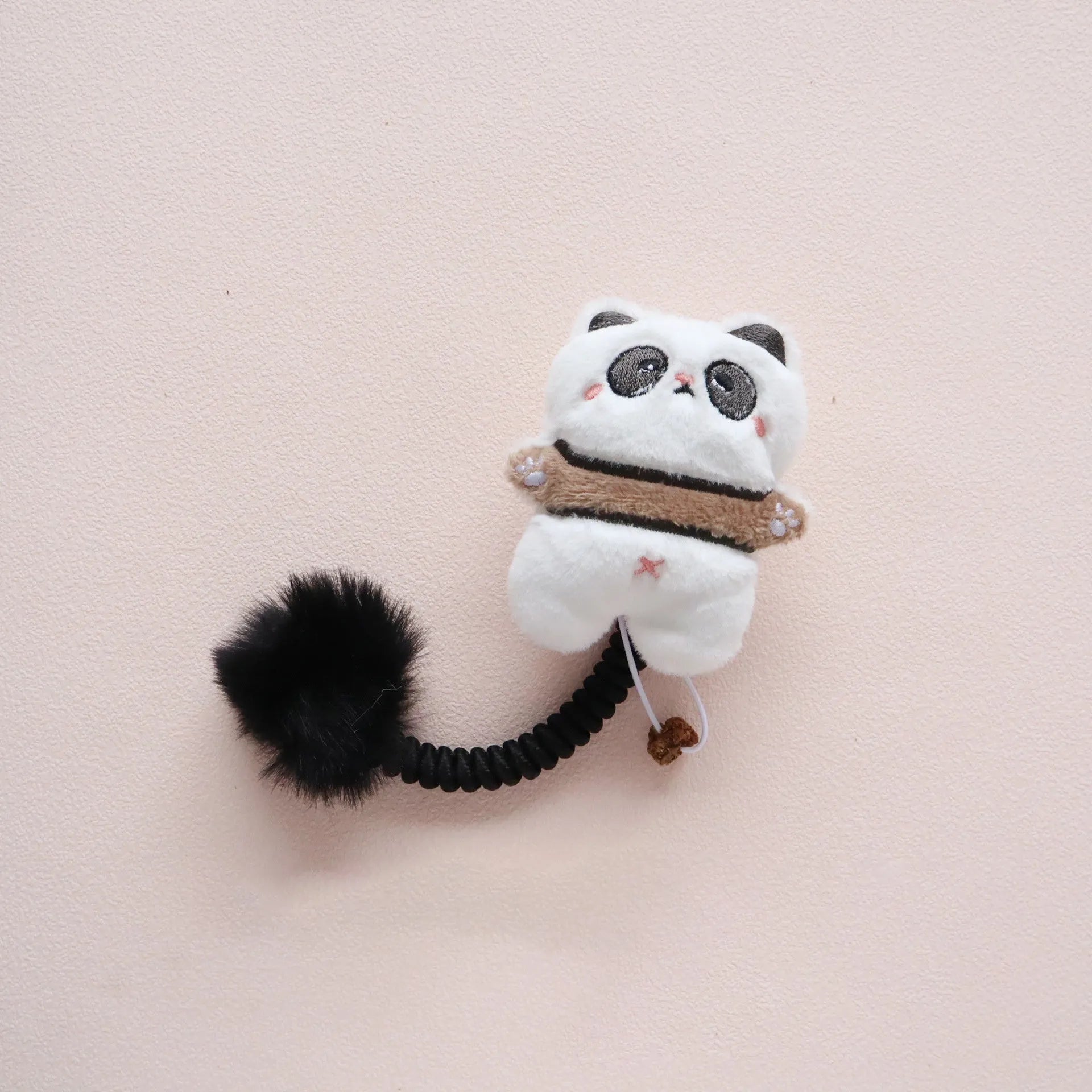 Set of interactive cat toys including a plush animal, silvervine fruit, a spring, and a fuzzy ball.