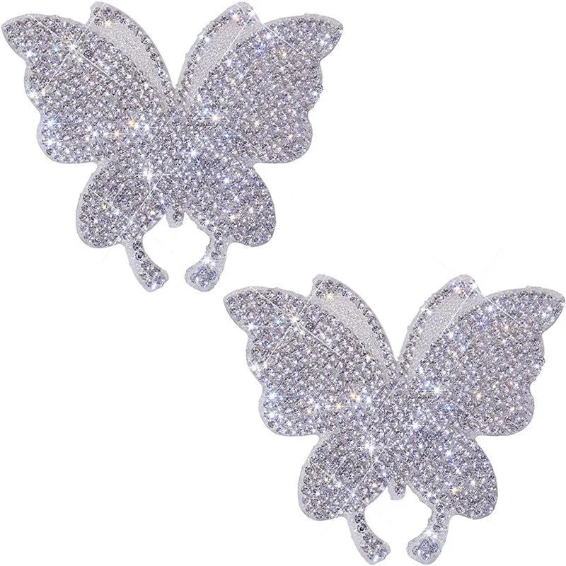 Close-up of a diamond-encrusted glass car sticker showing butterfly and bear claw design options.