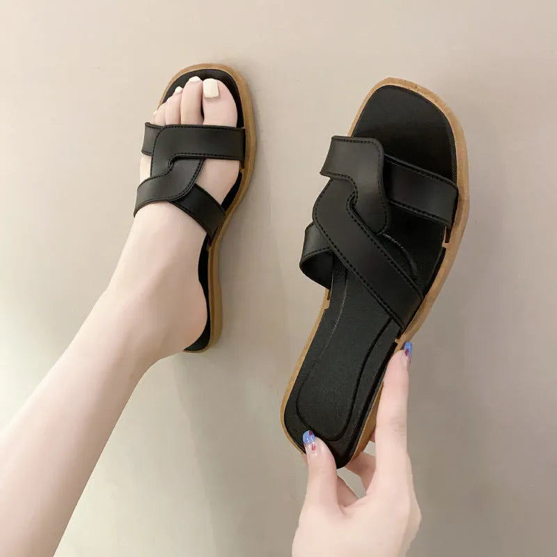 Women's PVC cross-strap sandals with toe ring and non-slip sole in light blue colour.