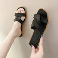 Women's PVC cross-strap sandals with toe ring and non-slip sole in light blue colour.