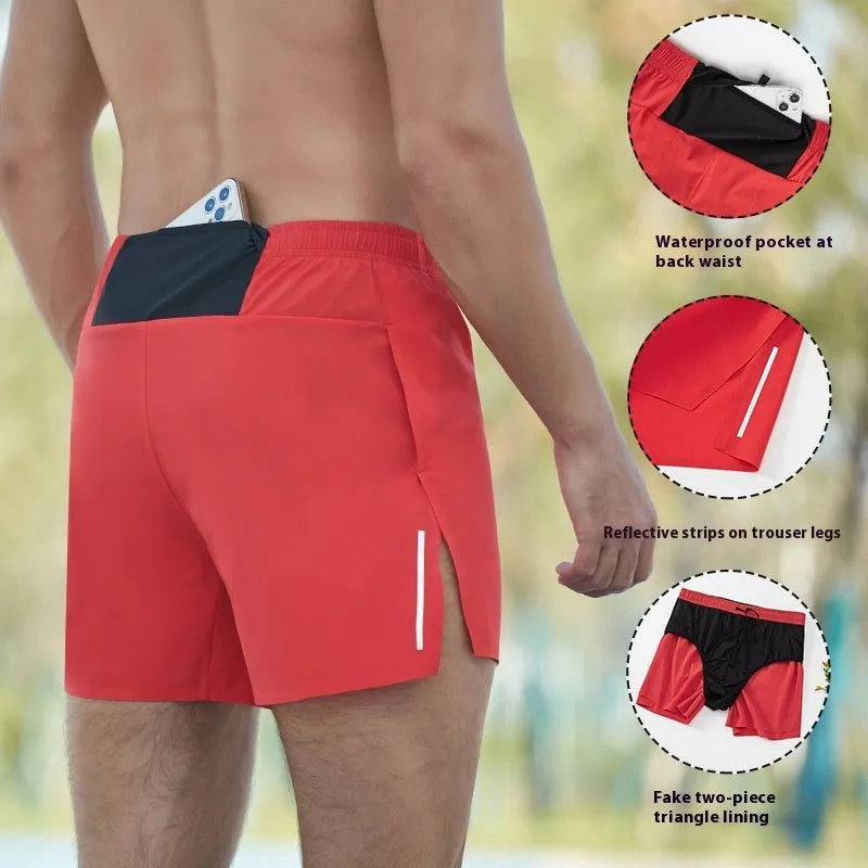 Men's loose-fit off-road running shorts in grey, showing high-waist design and built-in lining.