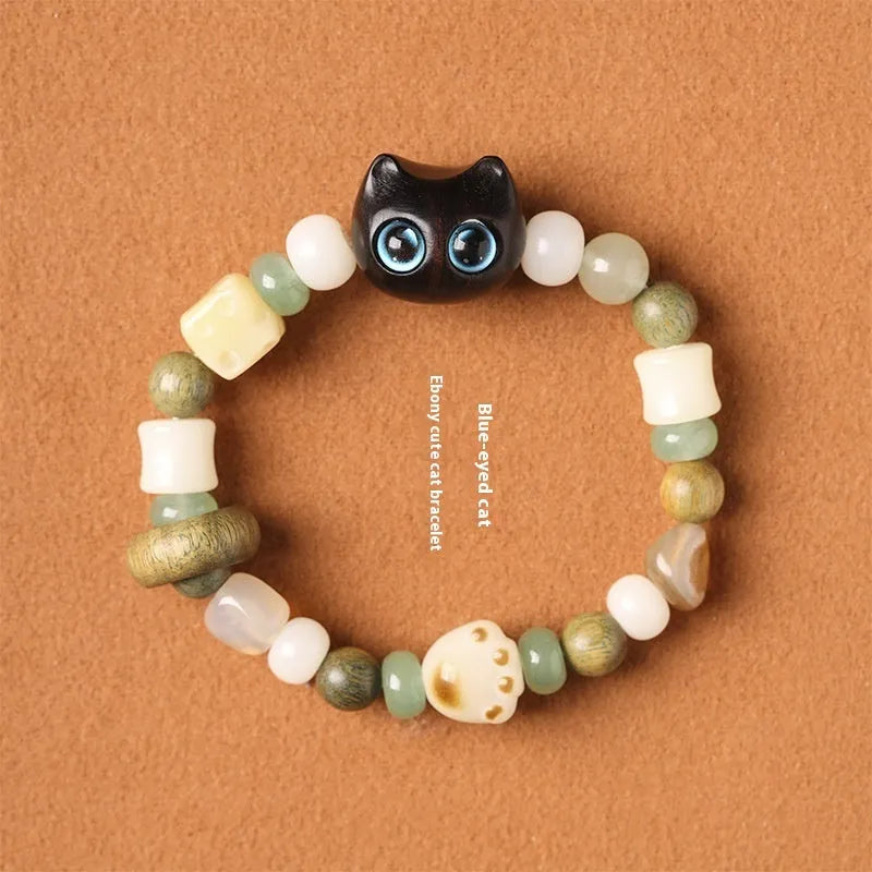Hand-woven beaded bracelet with a cat's paw charm, jade, and wood beads in a cartoon style.