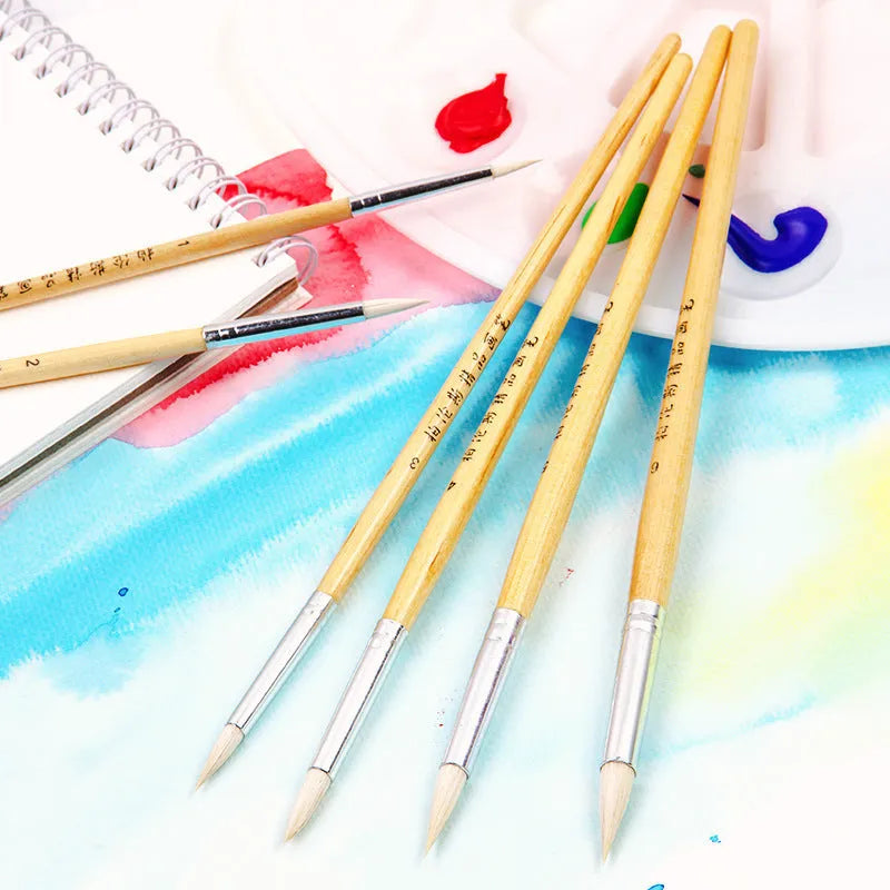 Set of six wooden artistic brushes with pointed wool tips for line work and calligraphy