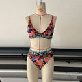 Women's floral print high-waist bikini set for swimming.