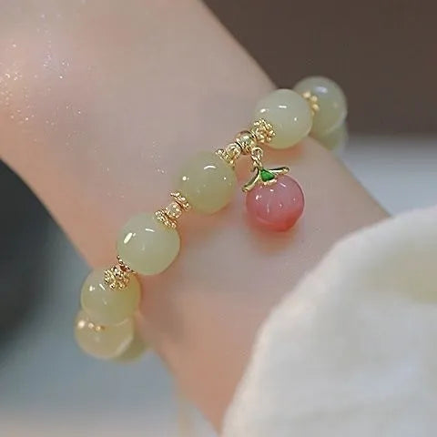 Handcrafted glass and coloured glaze bracelet with rabbit charm in national style design