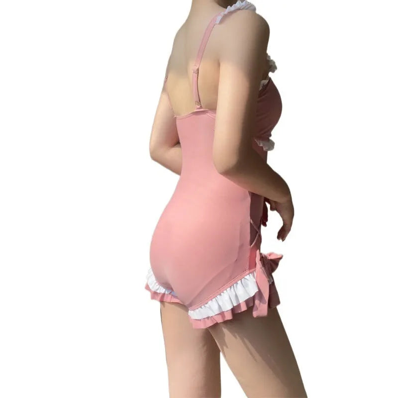Women's solid colour one-piece swimsuit in milk silk fabric, shown in pink.