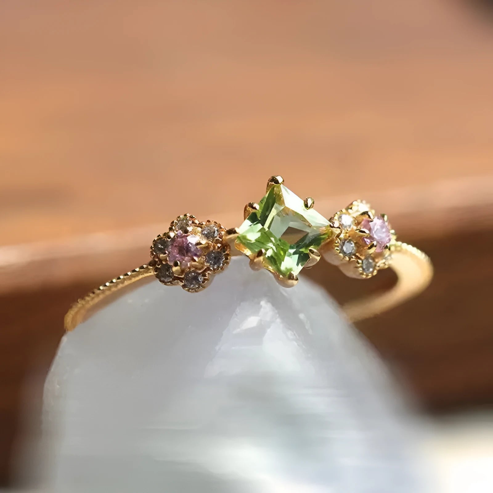 Copper geometric flower ring with Q740 gold finish on grey background, available in sizes No 6-10 for women