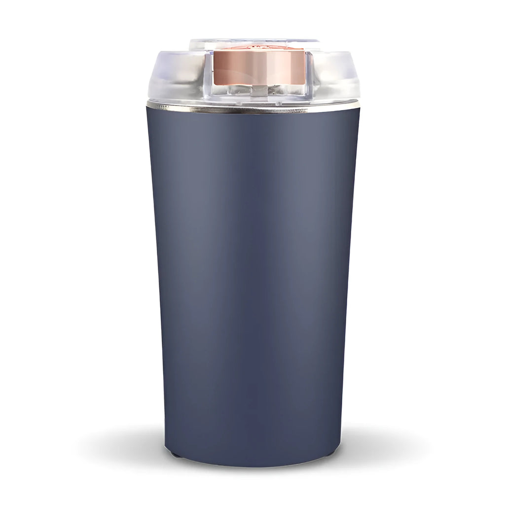 Blue mini flour mill and grinder with stainless steel construction on a kitchen counter.
