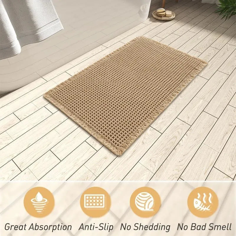 Square checkered pattern non-slip bathroom carpet on tiled floor in beige colour.