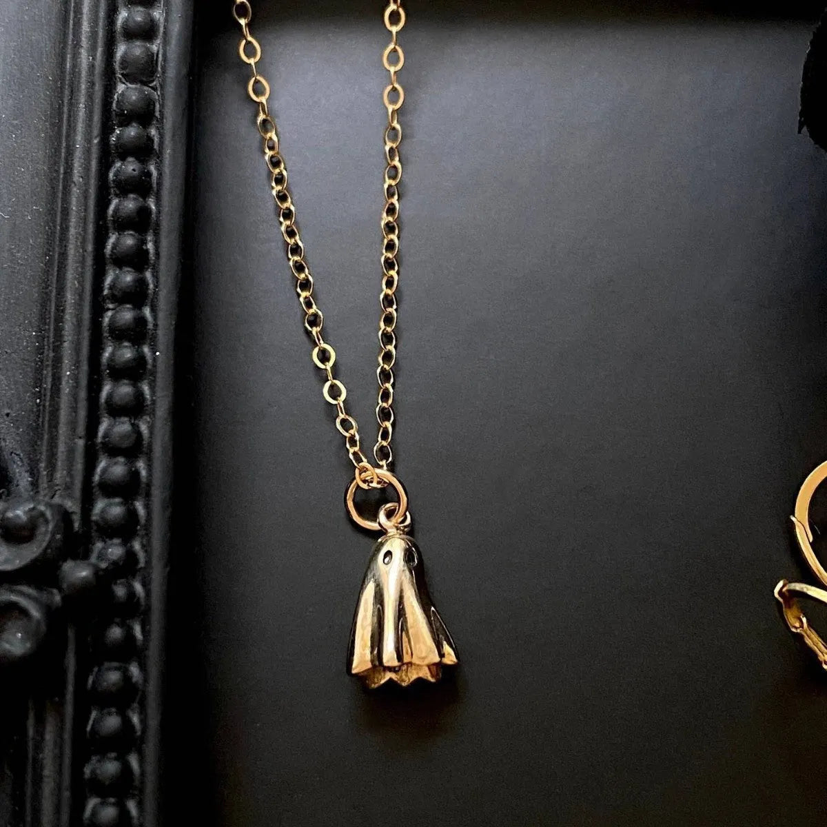 Stainless steel ghost pendant necklace with titanium steel charm on a choice of chains.