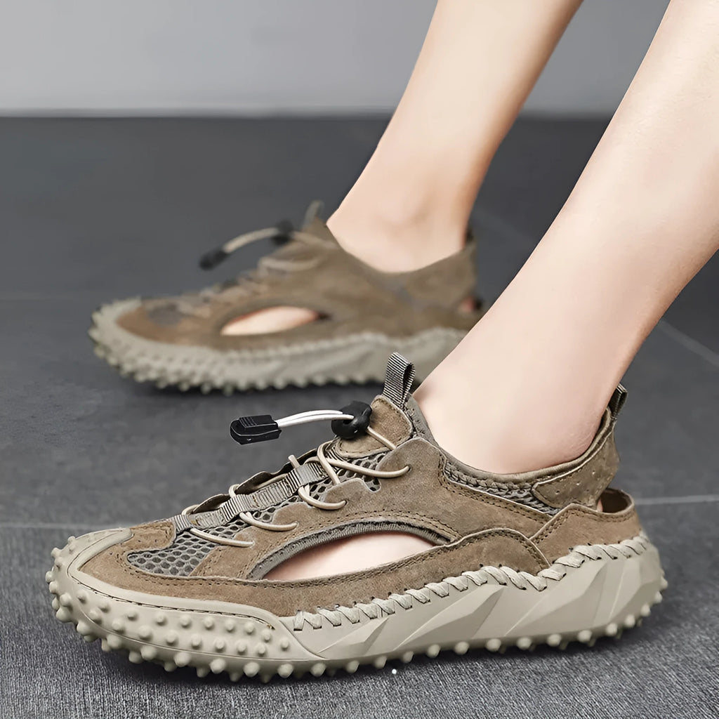 Men's waterproof sports sandals with leather mesh uppers, rubber soles, and elastic band closure in black, grey, or khaki