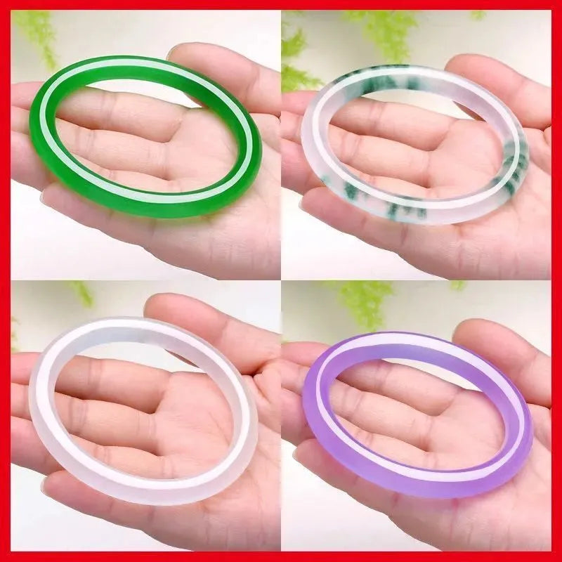 Jade bracelet with floating flower design and auspicious cloud patterns in ice-like emerald appearance