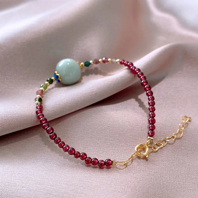 Women's aquamarine and garnet bracelet with drop shape stones and electroplated tourmaline elements