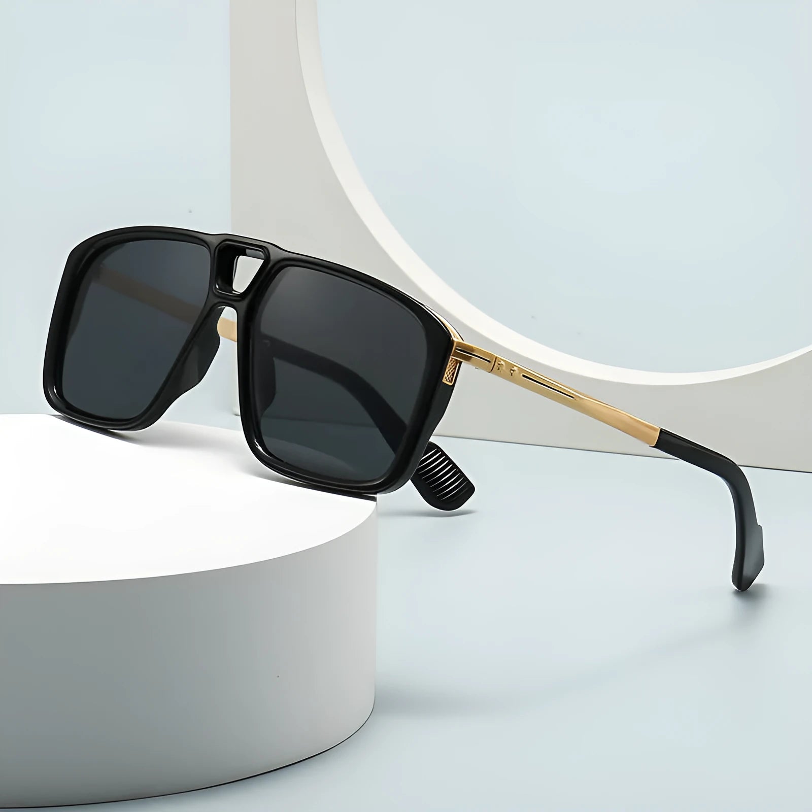 Men's retro double square sunglasses in six colour and style variations on a display.