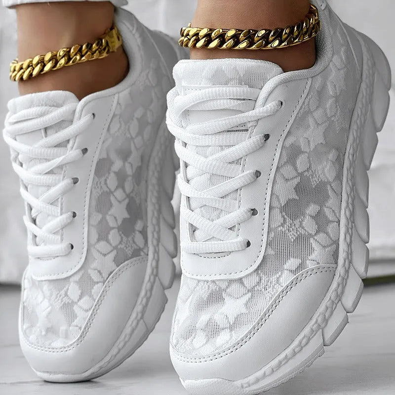Women's lightweight canvas running shoes with soft sole in white, black, blue, or pink colour options.