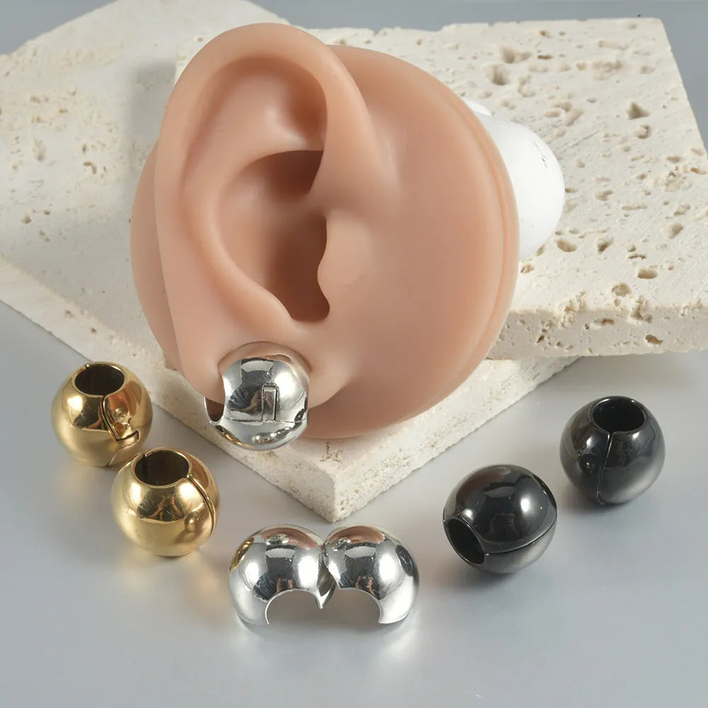 Stainless steel hollow skull and Buddha geometric earrings in electroplated colours.