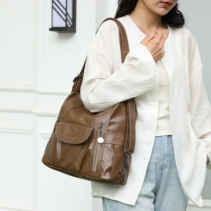 Women's multi-functional shoulder messenger bag in black PU leather with horizontal square shape and sewing line detailing