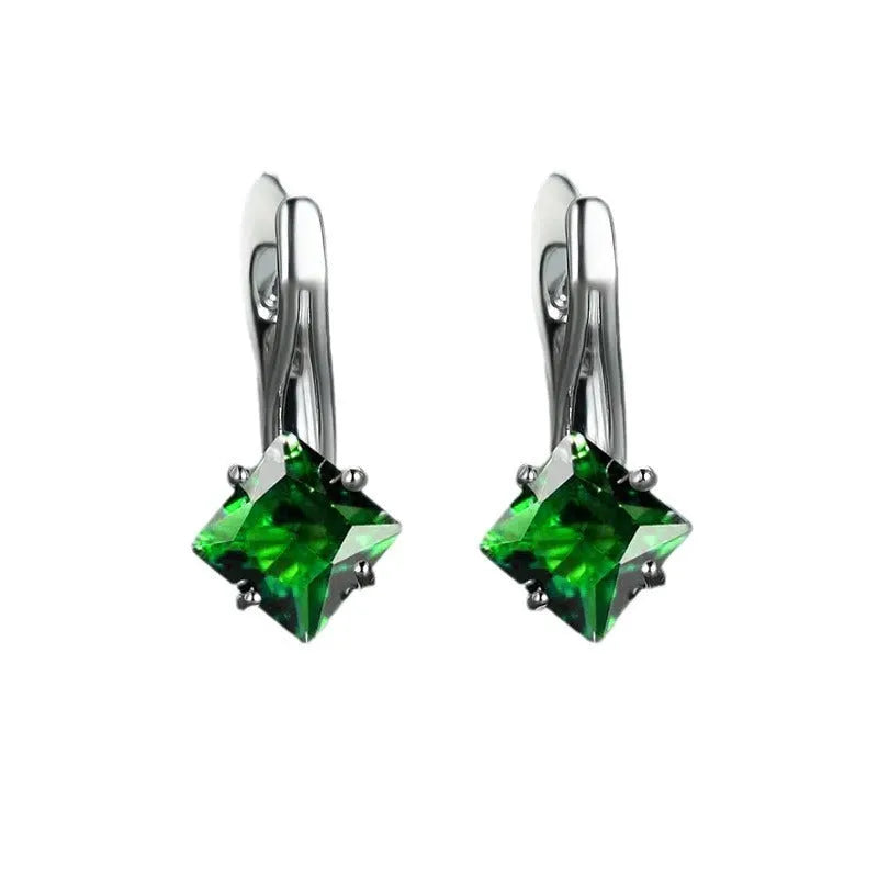 A pair of women's copper earrings with a simple diamond design and an inlaid zircon stone.