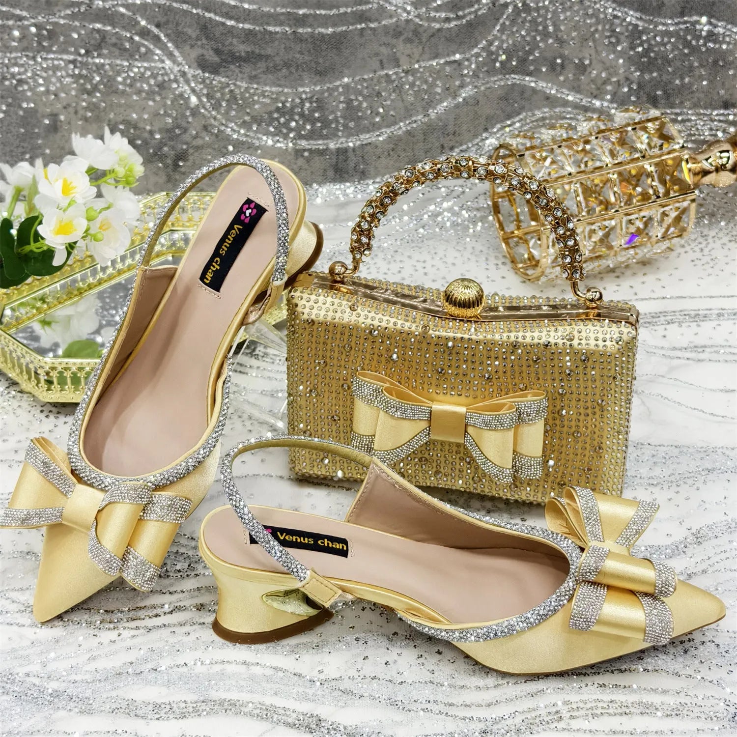 Women's pointed toe sandals with rhinestones and matching square bag in wine red colour