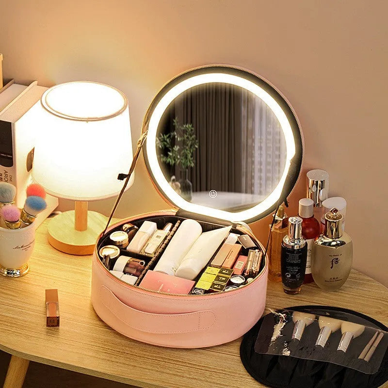 Round black smart LED makeup bag with lighted mirror open, showing internal partitions.