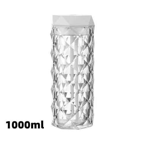 Crystal lamp humidifier with 1000ml tank showing cool mist and RGB night light on desktop