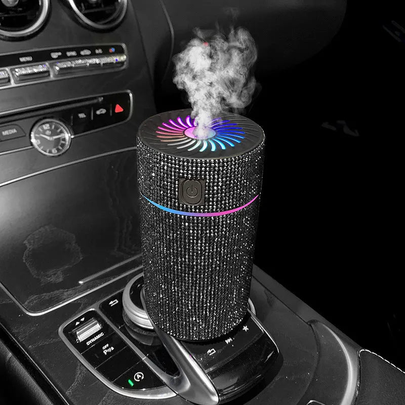 Compact white car air purifier humidifier with USB cord on car dashboard