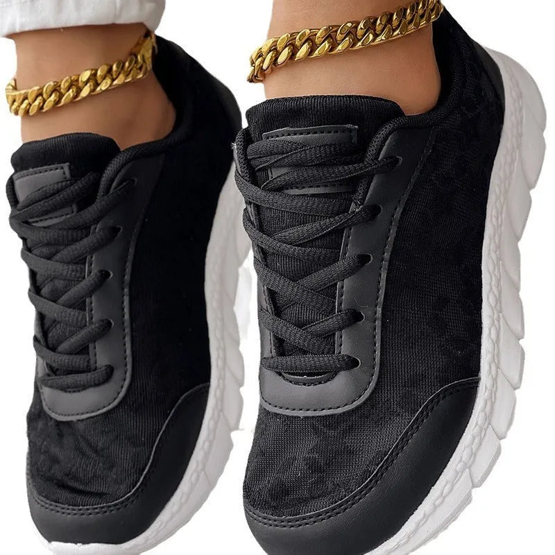 Women's lightweight canvas running shoes with soft sole in white, black, blue, or pink colour options.