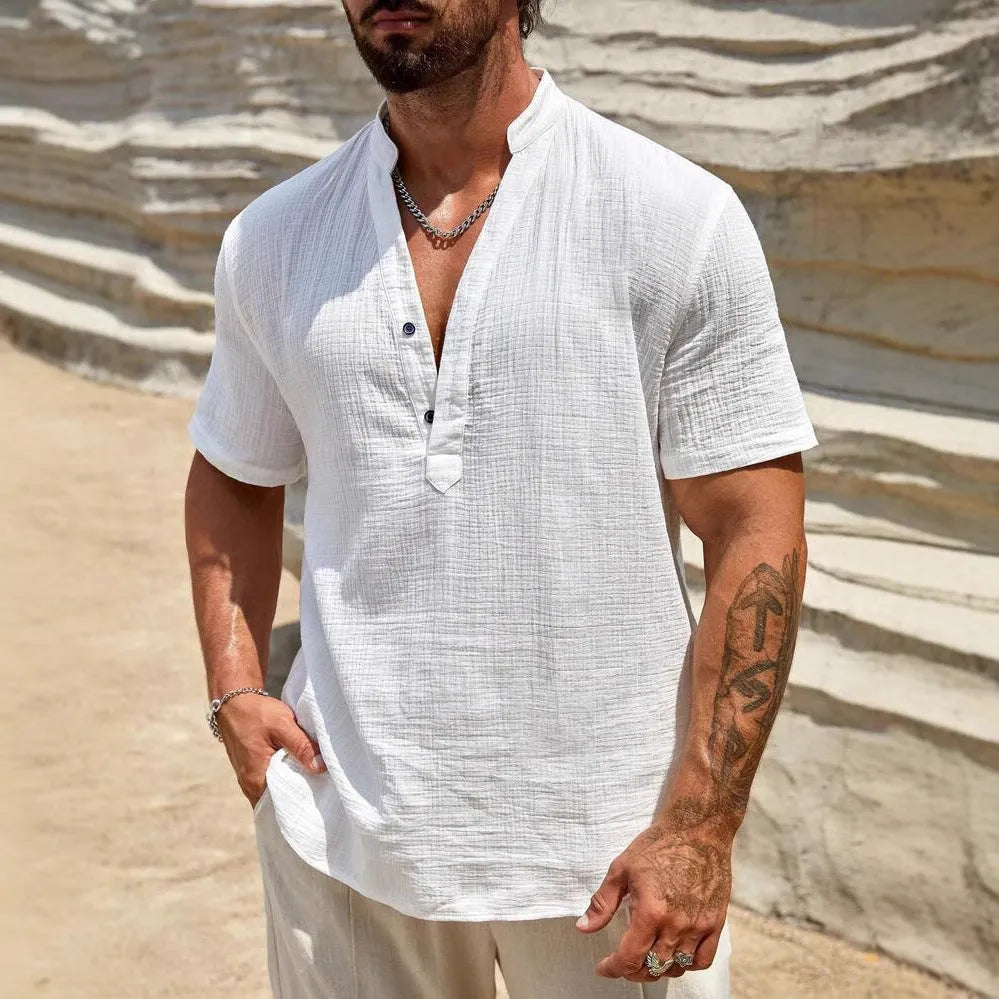 Men's solid colour short-sleeve casual shirt with stand collar on a hanger.