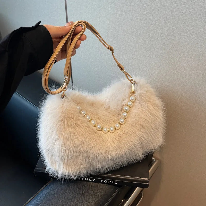 Plush shoulder bag with pearl chain, 27cm wide, shown in black for autumn winter commuting