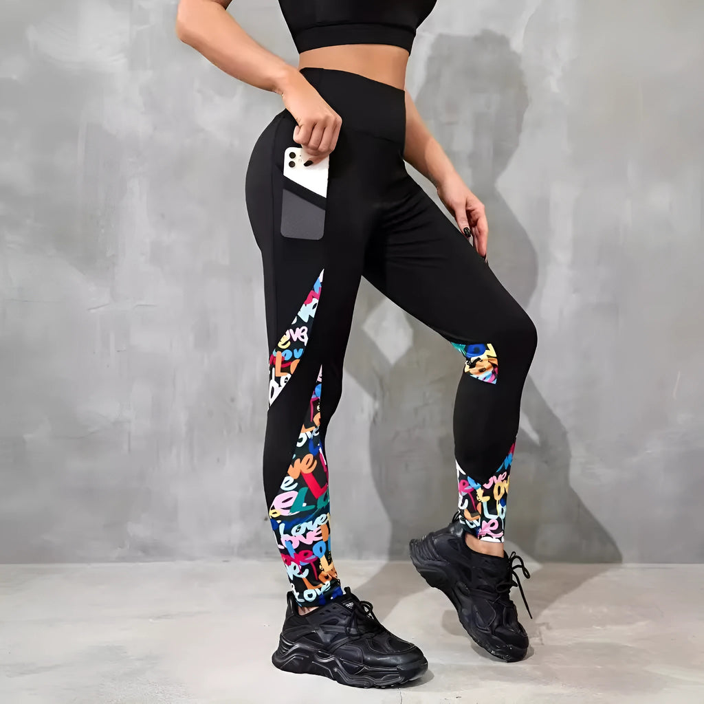 Black women's high-waist fitness leggings with colour-contrast patchwork patterns and side pockets.