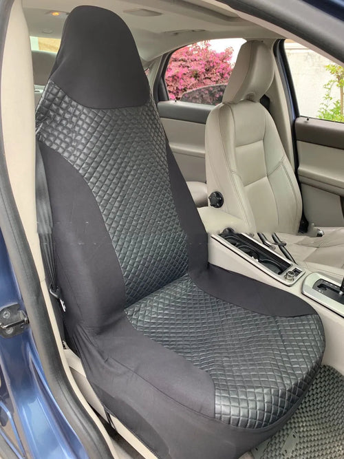 Black quilted automotive seat cover made of PU and polyester fabric, shown with plastic attachment hooks.