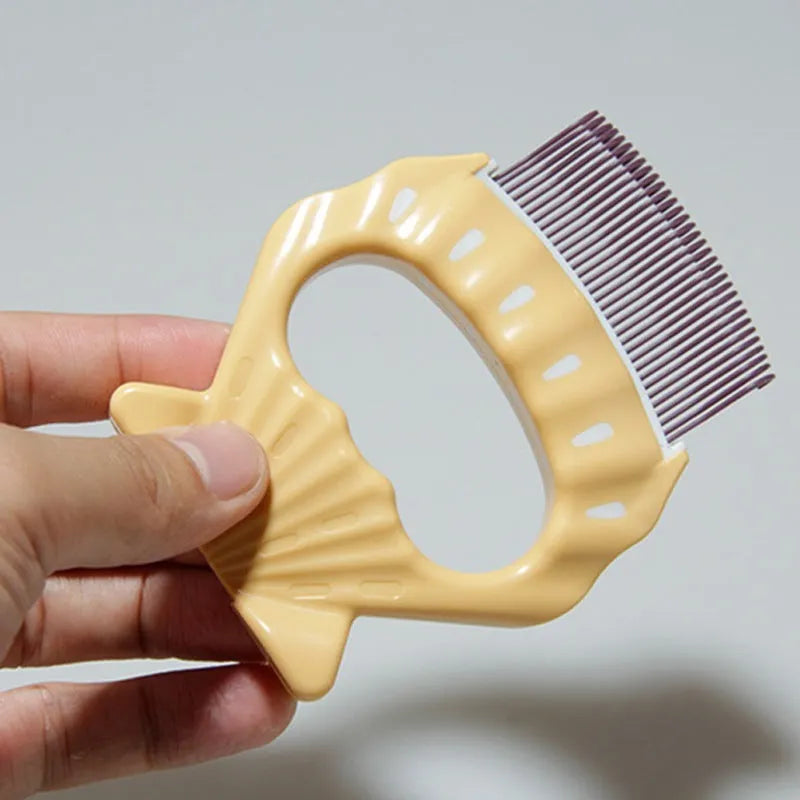 Green shell-shaped plastic pet grooming brush with bent wire bristles and anti-slip handle on a white background.