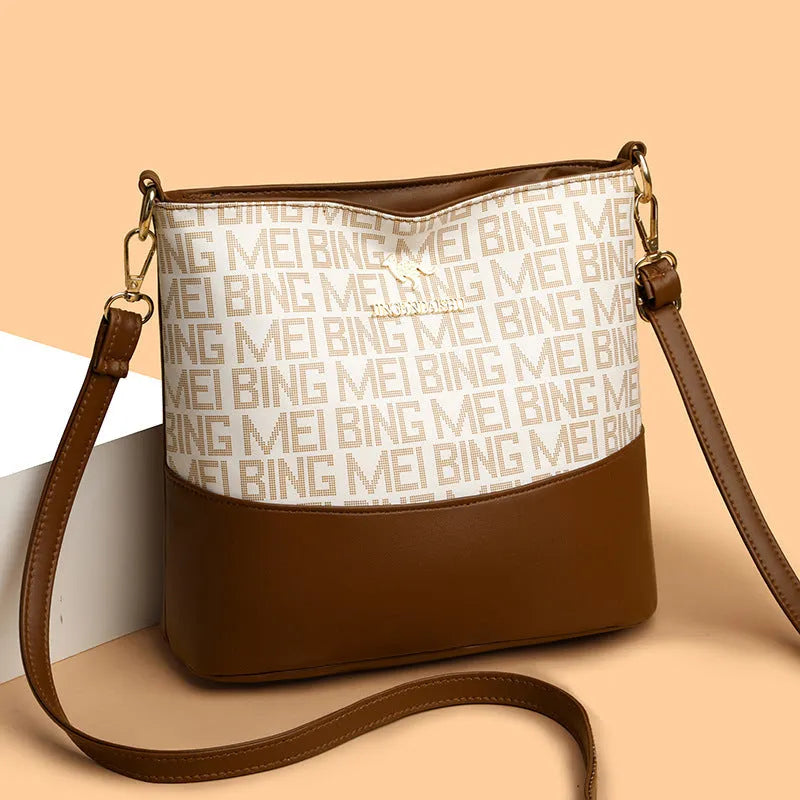 Brown retro messenger bag with soft leather texture showing interior phone and file compartments