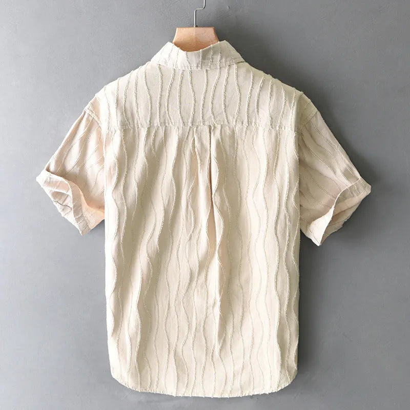 Men's apricot pure cotton loose fit short sleeve casual shirt on a hanger.