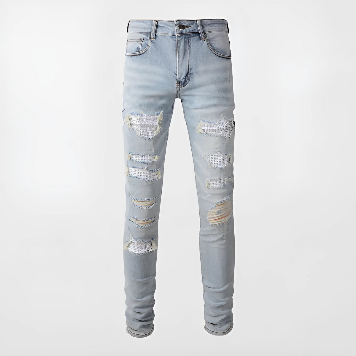 Light blue slim fit men's jeans with patch details, holes, and enzyme-washed finish