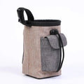 Adjustable waterproof waist bag for dog walking with side clip and multiple pockets.