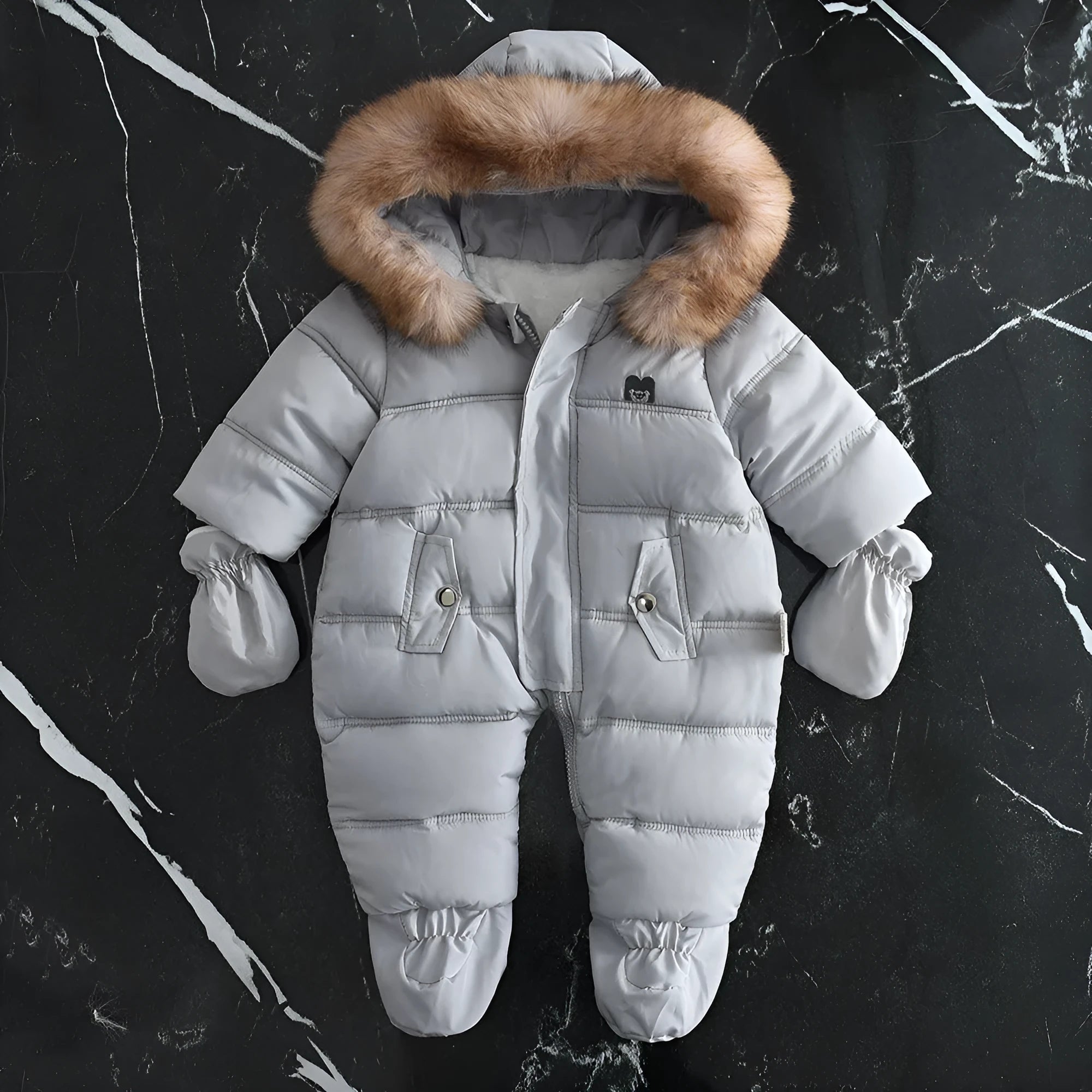 Fleece-lined thick hooded baby jumpsuit in beige with zip front and fur hood