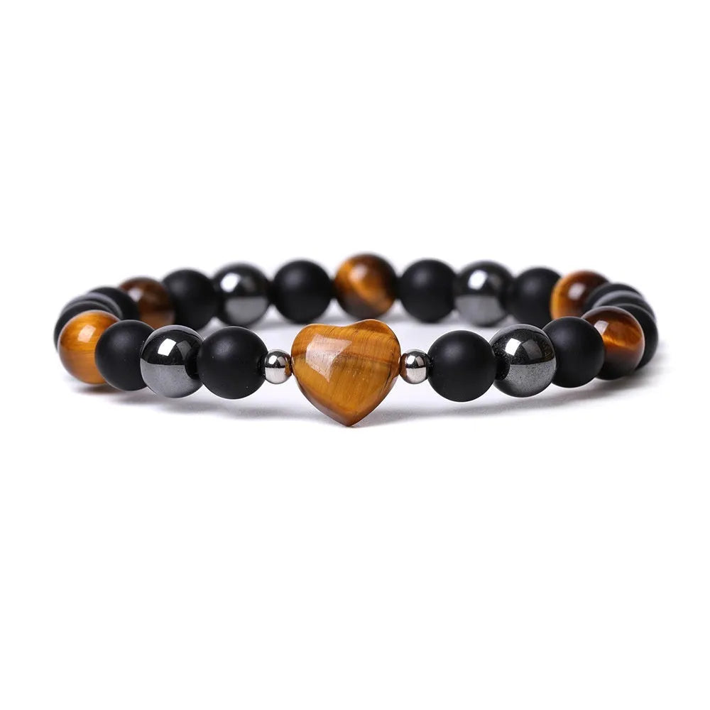 Hand-cut peach heart stone bracelet in geometric design with planetary elements