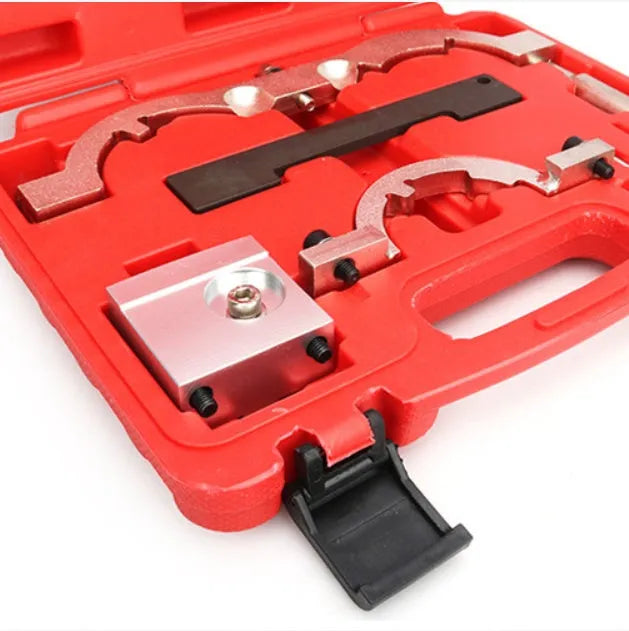 Red chrome-vanadium steel timing tool kit for Opel 1.4T LUJ engine on a workshop bench.