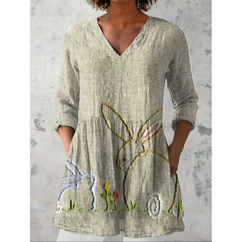 Women's printed loose dress with wide waist and 3/4 ruffle sleeves in a floral wave pattern.