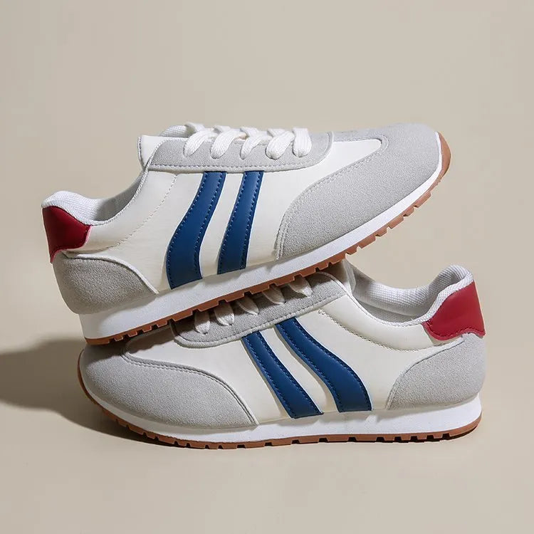 Blue and grey Cortez stripes casual sports shoes with round toe and flat rubber sole.