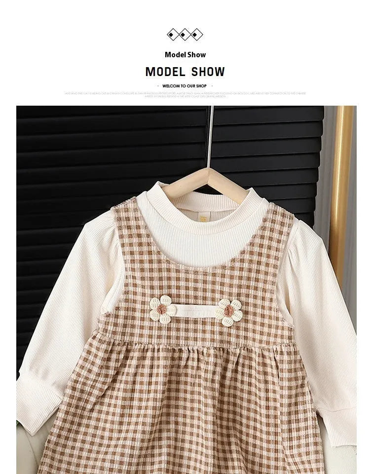 Baby girl wearing a dark coffee plaid Korean style long-sleeved dress suit with shirt.