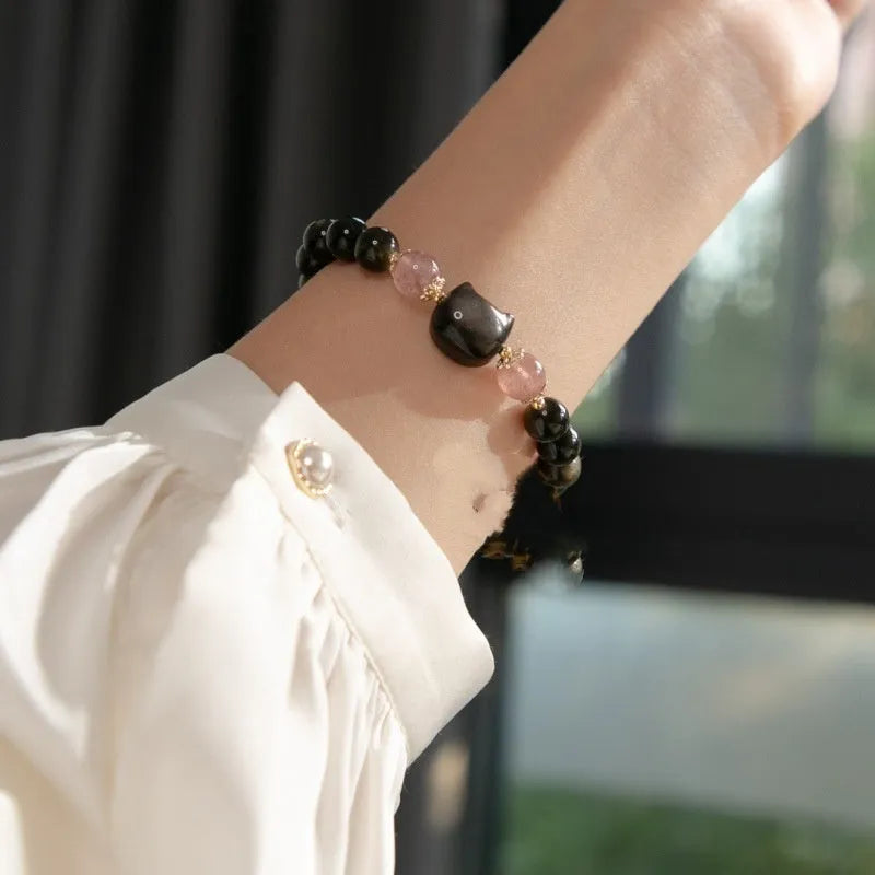 Black 8mm natural obsidian bead bracelet with silver kitty charm on elastic band