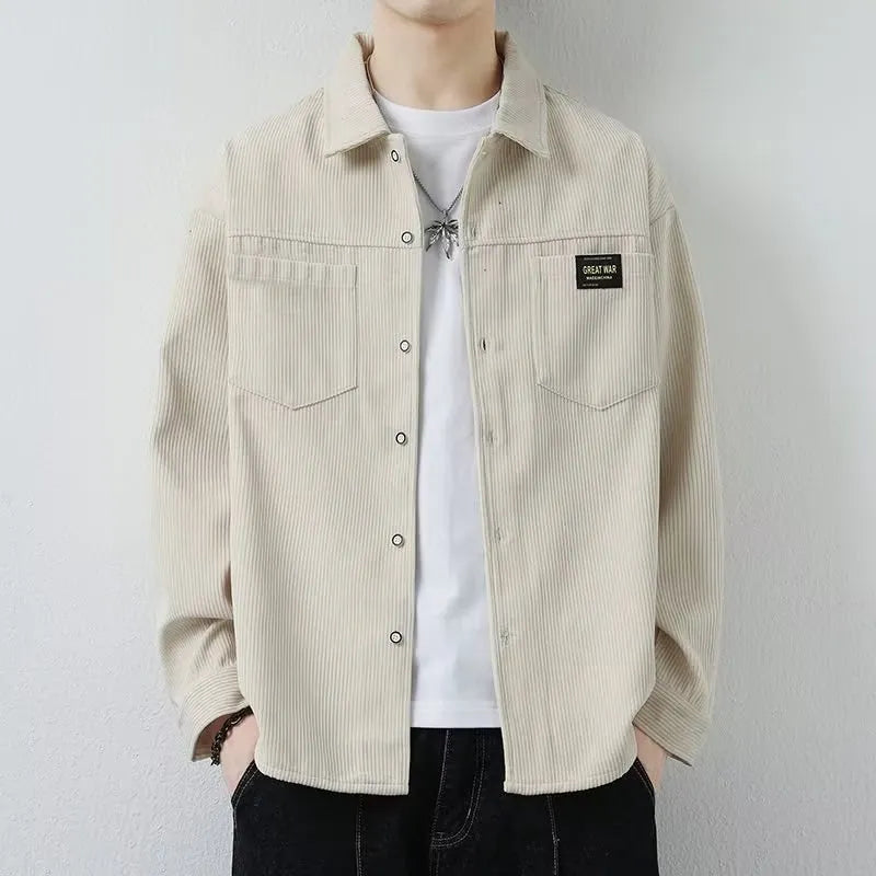 Men's black corduroy cardigan jacket with long sleeves on a hanger.
