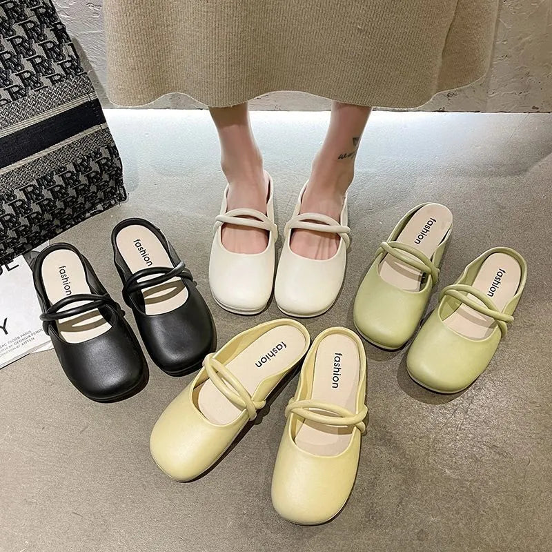 Women's black closed-toe plastic flip flops on a plain background, showing baotou style and strap design.