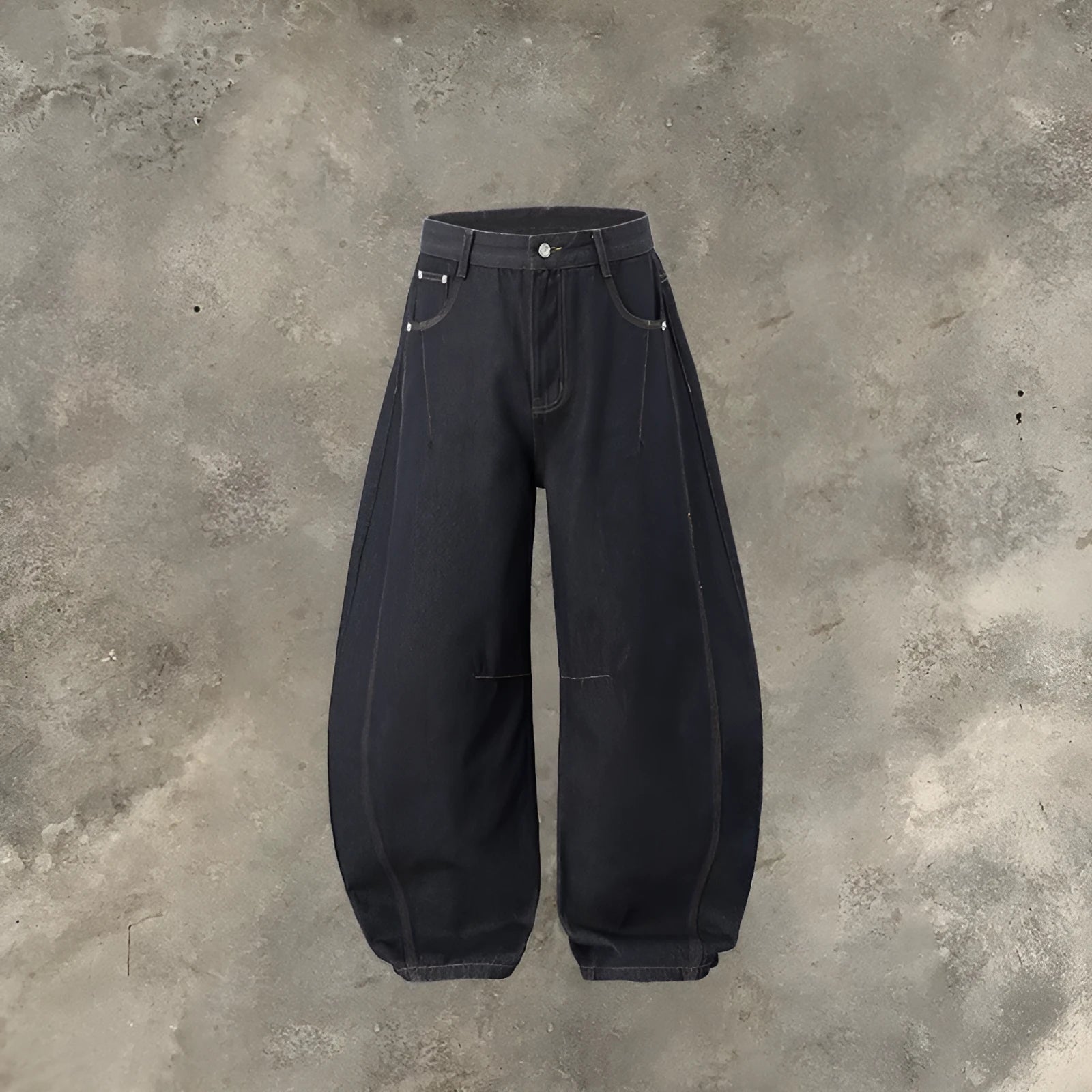 Men's wide leg denim trousers in original cow colour, laid flat to show mid-waist and relaxed fit.