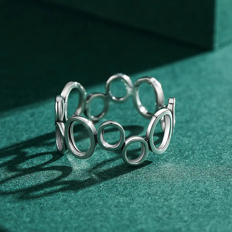 S925 sterling silver geometric circle ring with ellipse motif, women's size US 7 on display