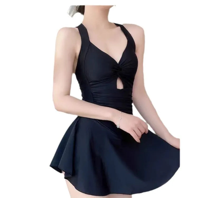 Women's boxer style one-piece swimsuit in backless design with solid colour options