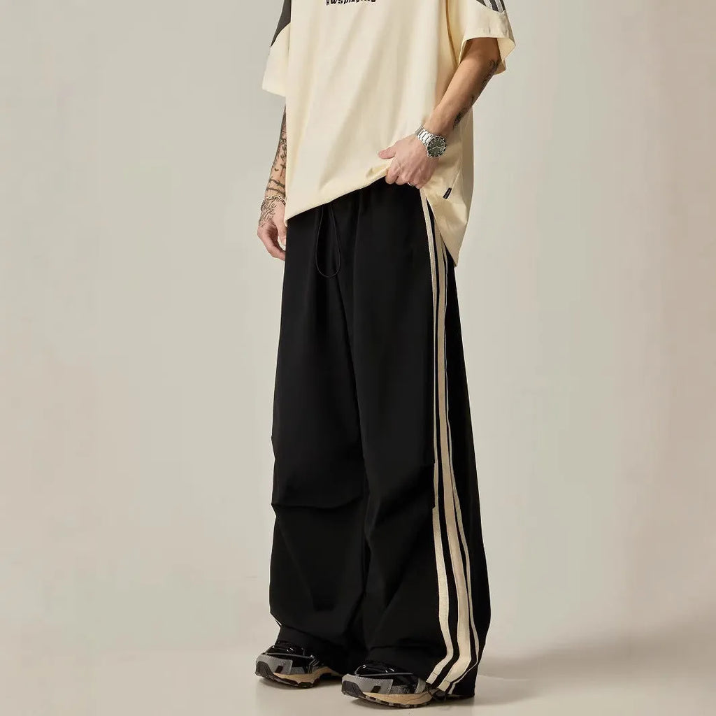 Black wide-leg climbing trousers for men with high waist and straight-leg design.